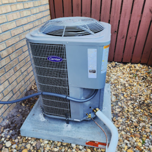 Outdoor Carrier AC unit installed for residential cooling